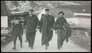 Image: King Rood, Unidentified Man, Robert Peary and Henry E. Rood Walking Ashore